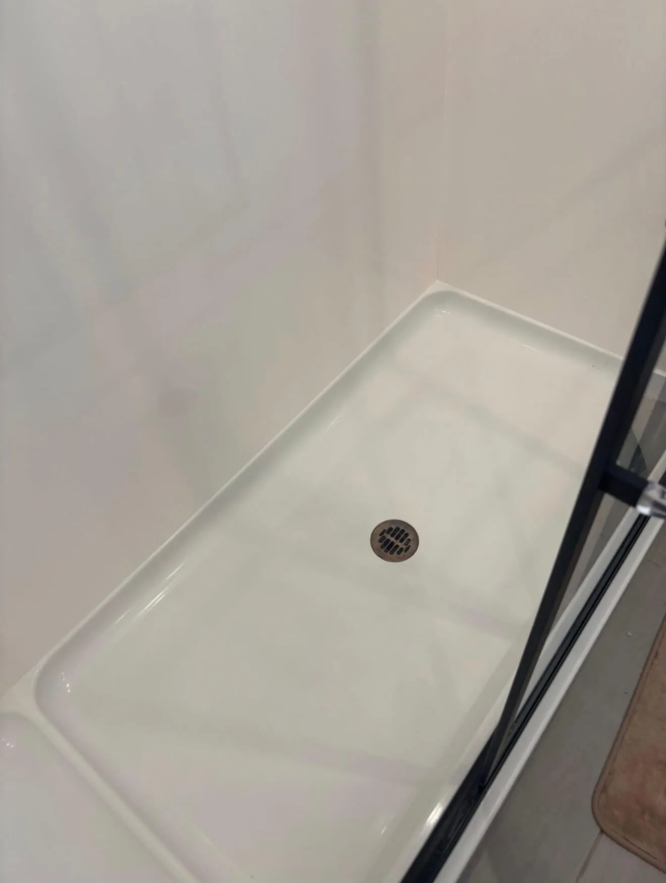 Shower pan after AZ Glitz and Glam bathroom cleaning